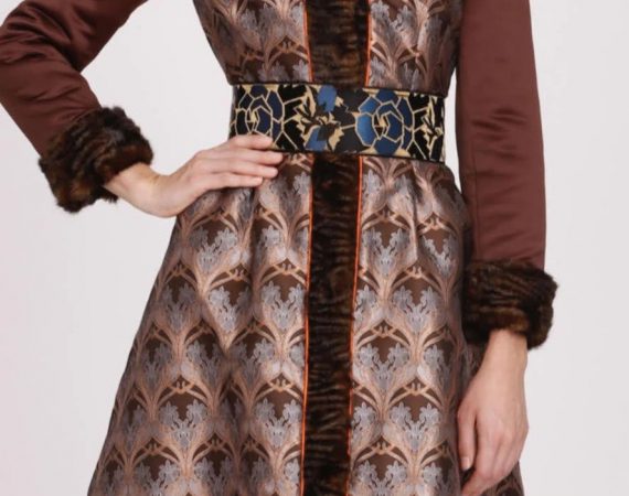 Marissa long coat in brown print with a belt, worn by a model