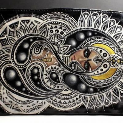 Ornate silver belt buckle on black